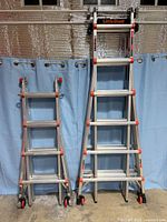 Both Little Giant ladders standing side by side fully retracted