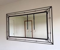 Front view of wrought-iron style rectangular mirror