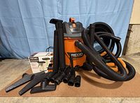 Vacuum with all accessories and boxed filter grouped together