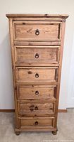 Front view of tall six-drawer chest showing entire piece