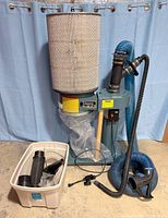 Dust collector with filter cartridge, clear bag and attached hoses