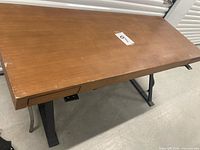 Top view of oak desktop showing surface and drawer fronts