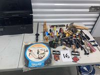overall view showing toolbox, tools spread on table, pop-up organizer package, Call of Duty patches
