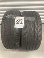 Two tires side by side showing tread pattern