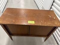 Full cabinet top and front view showing overall form and wear