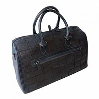 front view showing shark skin patchwork, handles, exterior zip pocket