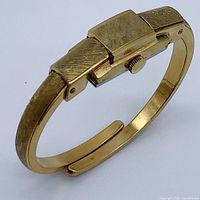 Angled view showing top of bangle watch and concealed dial segment