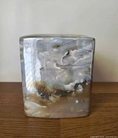 Front view of ceramic tissue box cover showing marble-look glaze