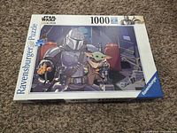 Front of Ravensburger puzzle box showing artwork and piece count