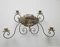 Front view of brass 5-candle wall sconce