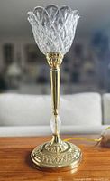 Full view of brass lamp with cut-glass shade