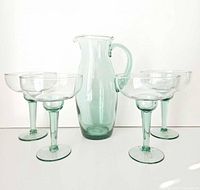 Full set showing pitcher with four glasses