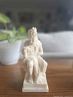 Front view of ivory-tone resin Moses figurine on square base