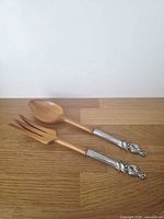 Fork and spoon set on wood surface showing overall appearance