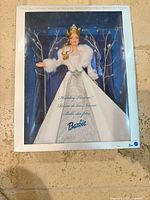 Front of sealed Holiday Visions Barbie 2003 box showing doll and attire