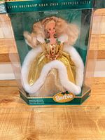 Front view of boxed Barbie doll showing gown and branding