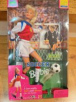 Front of sealed Soccer Barbie package showing doll, soccer ball and goal