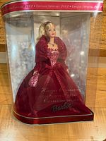 Front of sealed clear-front box showing Barbie in burgundy gown
