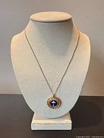 Necklace on display bust showing full length and pendant