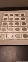 Front view of 20 Canadian dollars in 2x2 cardboard flips (4×5 layout)