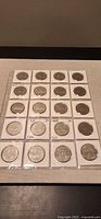 Full set of 20 Canadian dollar coins in 2×2 flips within plastic page