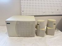 Front view of subwoofer and two satellites