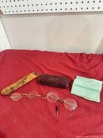 All items overview: two eyeglasses, two cases, cloth, screwdriver