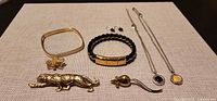 All seven jewelry pieces laid out for overview