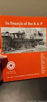 Front cover showing title, authors Carol Bennett & D.W. McCuaig, locomotive image, maple leaf logo