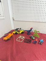 Group shot of entire lot on red cloth