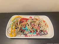 Tray showing entire assortment of mixed beaded jewellery