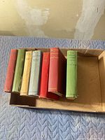 Six Maurice Walsh clothbound hardcovers in open box