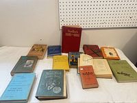 Overview of all 14 books laid out on table