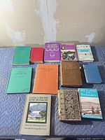 All ten Scottish-themed books laid out on padded surface for overview