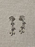 Front view of both earrings showing leaf drops and rhinestones
