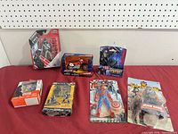 Group shot of all seven sealed items on table