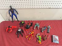 Group shot showing all figures, vehicles, and card deck