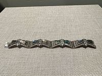 Overall view of sterling panel bracelet showing stones and design