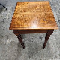 Top view of rectangular solid wood table showing grain and finish