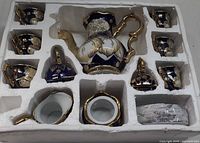 Foam tray showing full set pieces and missing sugar bowl base