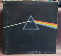 Front cover of LP showing prism artwork with wear