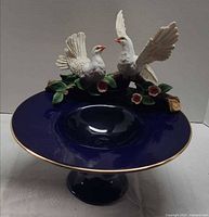front view pedestal compote with dove figurines