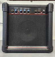 Front view of AK15G guitar amplifier showing grille and cabinet