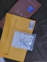 Loose moissanite packaging, guarantee booklet, bubble wrap sleeve