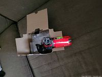 Top view showing red camcorder in open box
