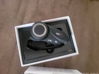 Top view of headset seated in inner tray of retail box