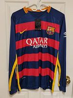 Front view of Nike FC Barcelona Messi jersey with tag attached