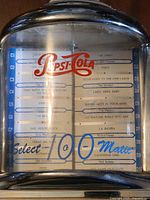 Front view of Crosley Pepsi-Cola jukebox showing song list and logo