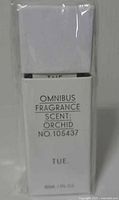 Front of sealed Omnibus Fragrance box showing scent, model number and volume