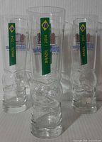 Front view showing Brazil 2014 graphics and soccer-ball base on three of the glasses
